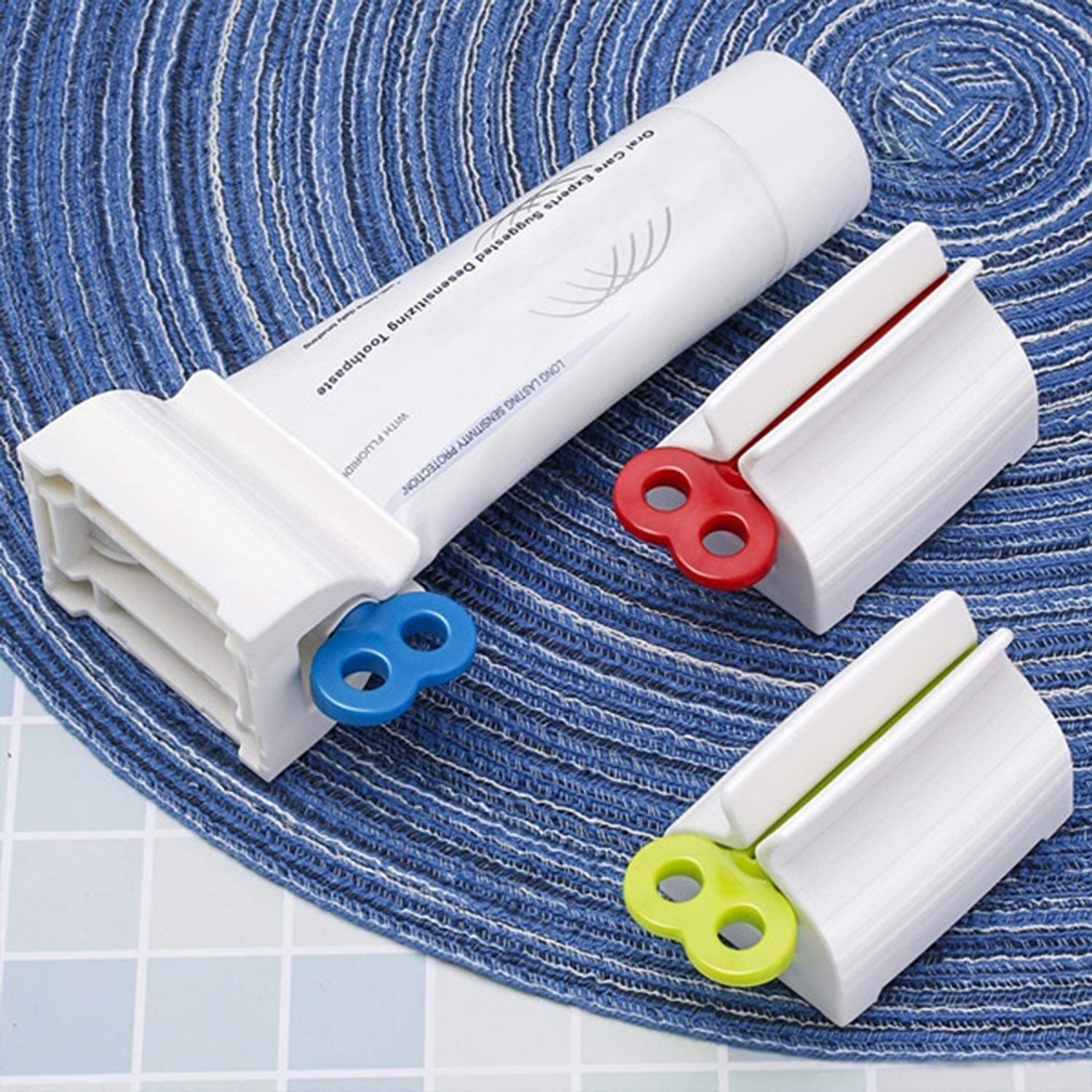 Stand for toothpaste tubes with built-in squeezer