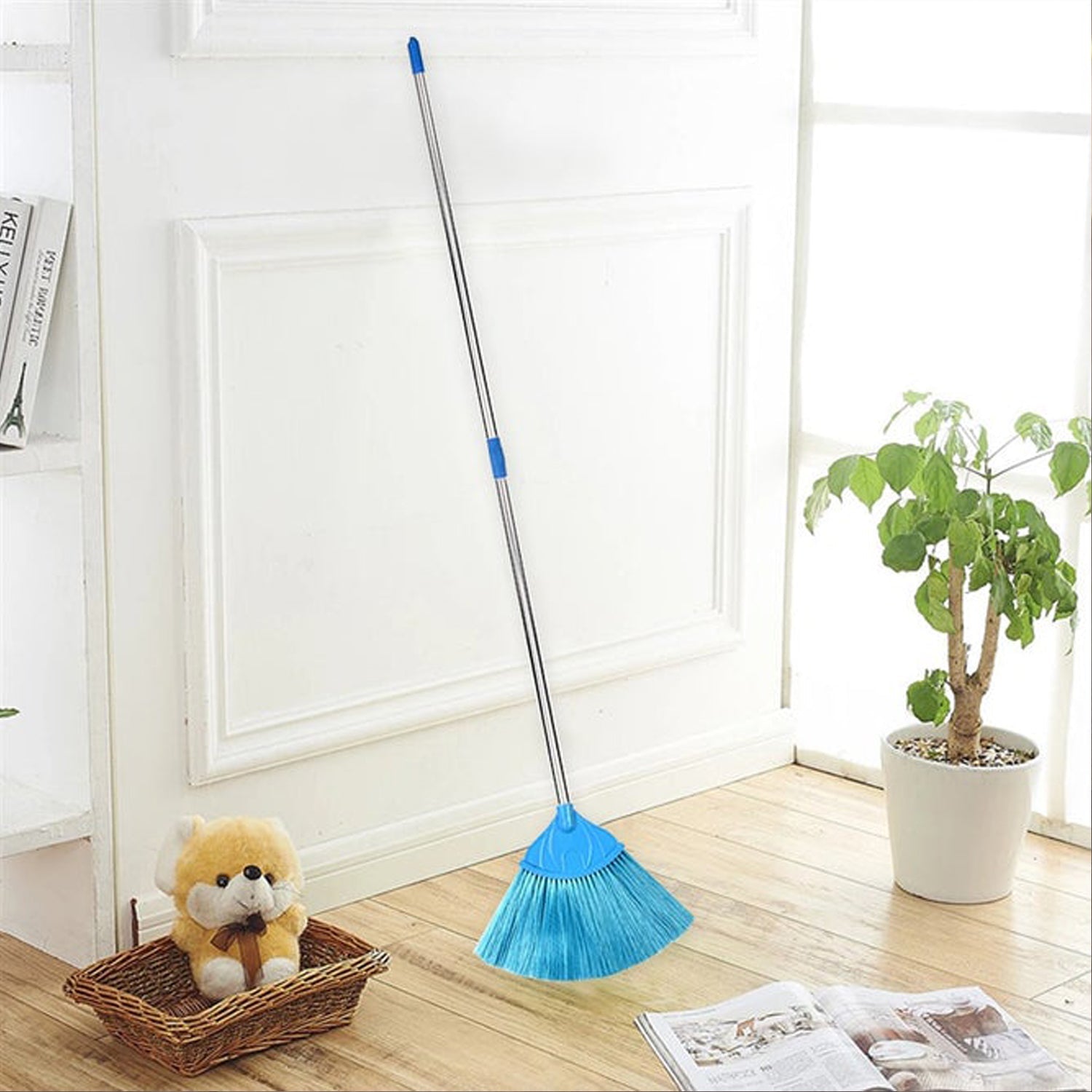 Ceiling broom fan shown in use for cleaning and dusting floor surfaces effectively.